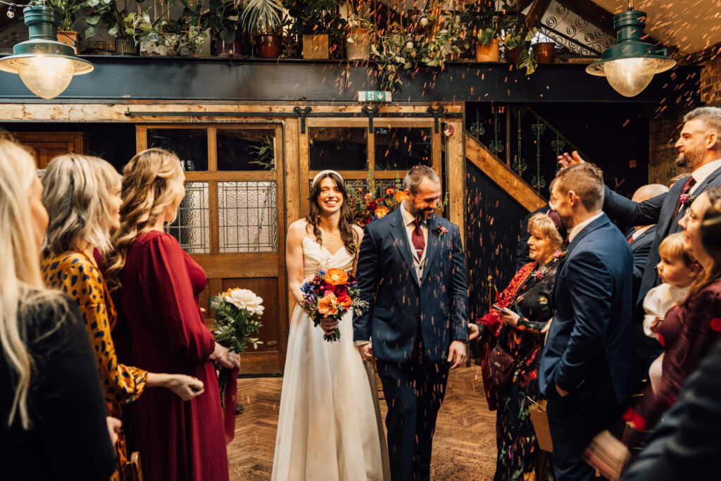 A couple just married at Clapton Country Club in London. Shot by UK wedding photographer, Chris Goddard.