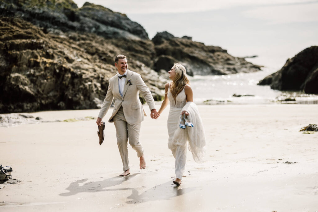 Married couple on a beach in cornwall, shot by wedding photographer chris goddard