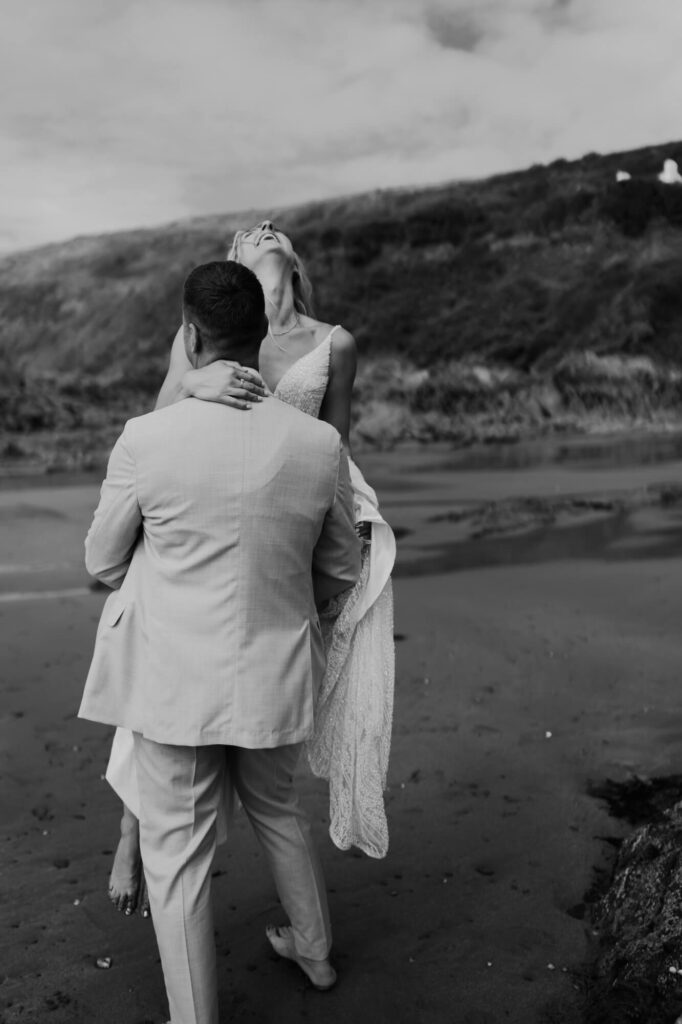 Married couple at cornish coastal wedding, shot by wedding photographer, chris goddard