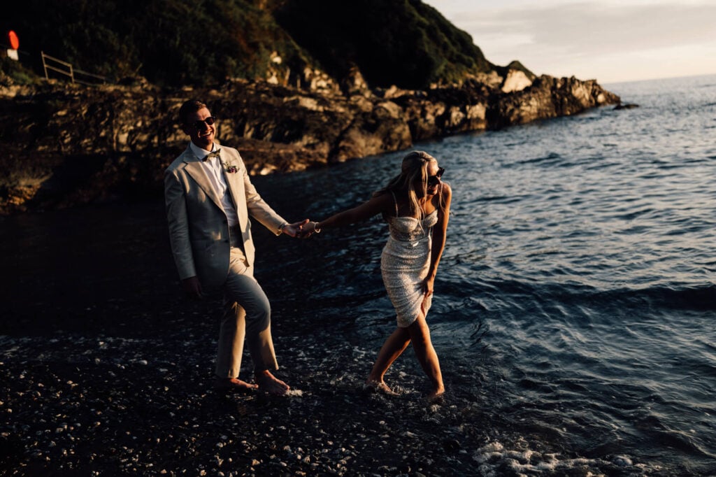 Married couple at cornish coastal wedding, shot by wedding photographer, chris goddard