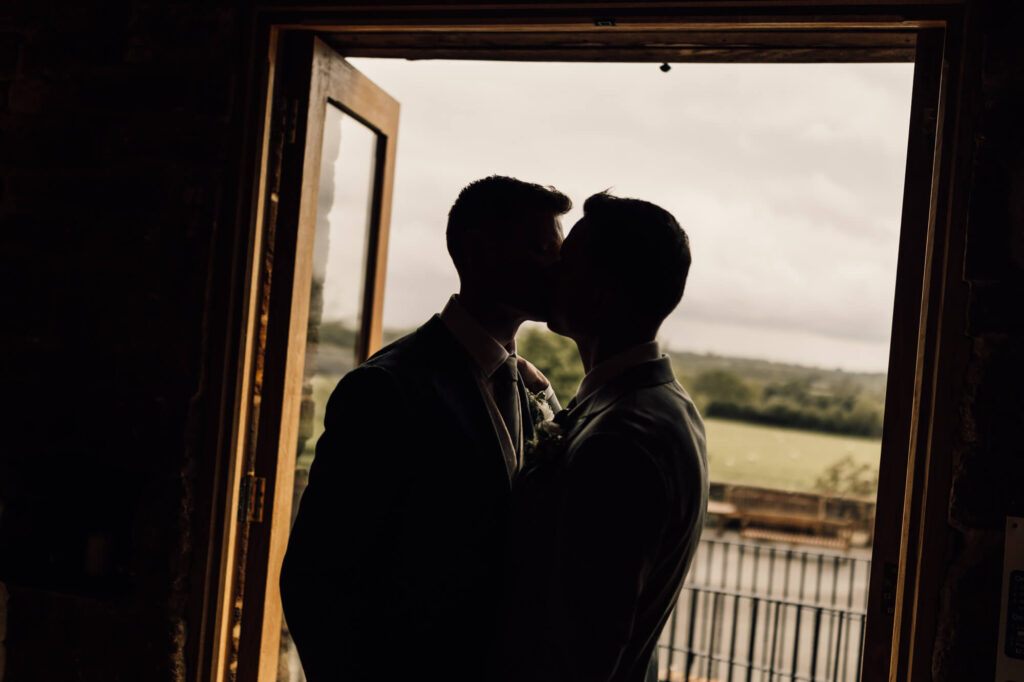 Image of two grooms shot by devon and cornwall wedding photographer, chris goddard