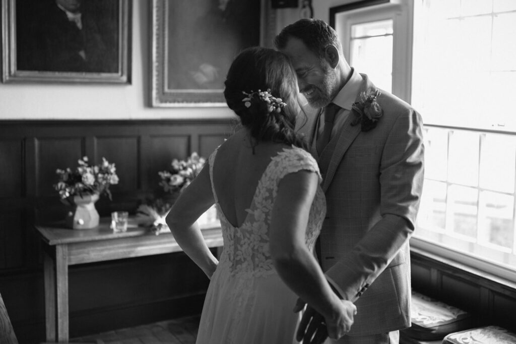 Bride and Groom getting married at Lyme Regis Guild Hall. Shot by Dorset, Devon and Cornwall Wedding Photographer, Chris Goddard